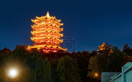 Photo for Yellow Crane Tower at twilight, the traditional Chinese multi-storey tower located on Sheshan (Snake Hill) in Wuhan, Hubei, China - Royalty Free Image
