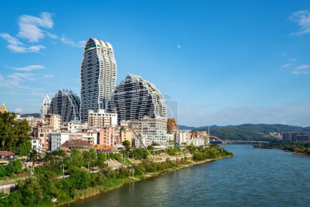 Photo for Lancang River and buildings on both sides, cityscape of Xishuangbanna, Yunnan, China. - Royalty Free Image