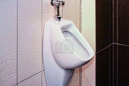 Photo for Men's room with white urinal in line. Comfortable male toilet urinal, Modern clean public toilets - Royalty Free Image