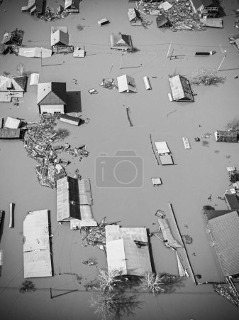 Photo for The village and numerous private houses and estates flooded to the roof with water during spring floods and river overflows - Royalty Free Image