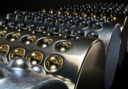 Foto de Serie abstracta de primer plano conceptual de tubos ilustrados 3D de hierro y oro con hoyuelos positivos y negativos en fila sobre un fondo oscuro. - Imagen libre de derechos