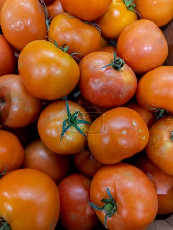 Photo for Fresh tomatoes in cardboard boxes in a supermarket ready for sale - Royalty Free Image