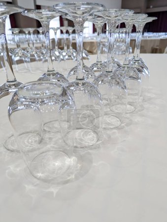 Photo for Toast to Memorable Moments: Abundance and Elegance at a Restaurant Table, Adorned with Empty Wine Glasses Ready for Cheers and Celebrations - Royalty Free Image
