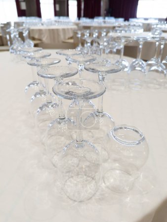 Photo for The Art of Wine Appreciation: A Captivating Scene at a Refined Restaurant Table, Showcasing an Assortment of Empty Wine Glasses, an Invitation to Delight in the Finest Flavors and Toast to Unforgettable Moments - Royalty Free Image