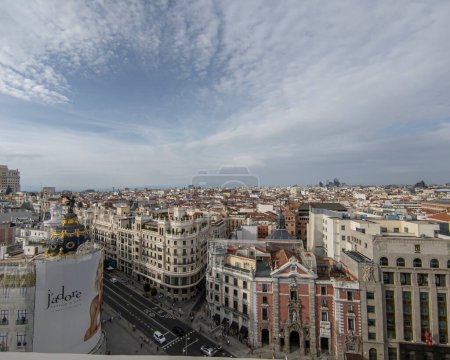 Photo for Unforgettable Panoramic Vantage: Glimpsing the Bustling Energy of Madrid's Gran Via from a Spectacular Rooftop Overlook - Royalty Free Image