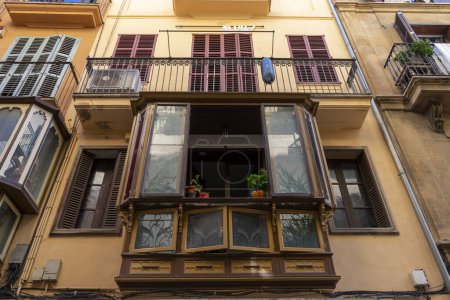 Photo for From terracotta rooftops to ornate shutters, experience the vibrant tapestry of design and culture on the streets of Mallorca. - Royalty Free Image