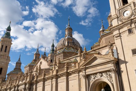 Photo for Grand front view of Basilica del Pilar's Baroque facade, adorned with sculptures, under a vibrant blue sky - Royalty Free Image