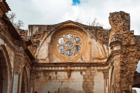 Photo for A sky-framed view of the rosette window in the Monasterio de Piedra, reflecting the Gothic architectural style - Royalty Free Image
