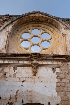 Photo for A sky-framed view of the rosette window in the Monasterio de Piedra, reflecting the Gothic architectural style - Royalty Free Image