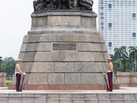 Photo for Manila, The Philippines - August 8, 2017: Two soldiers guarding the Jose Rizal Monument at Rizal Park along Roxas Boulevard in Manila, Philippines. - Royalty Free Image
