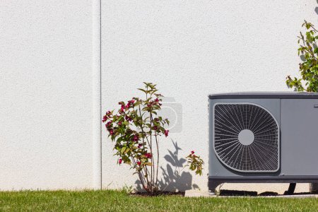 Photo for Heat pump in a new building area with modern house facades of south germany on a sunny day in springtime - Royalty Free Image