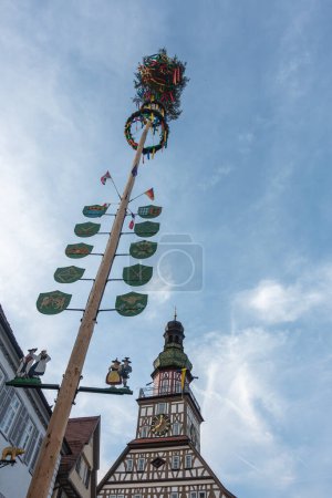 Photo for Colorful maypole in historical city of south germany on a sunny springtime day with blue sky - Royalty Free Image