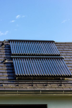 Photo for Solar water collectors on rooftop in south germany new area building - Royalty Free Image