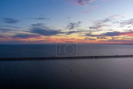 Photo for Aerial view of the Jubilee Parkway bridge and Mobile Bay at sunset on the Alabama Gulf Coast - Royalty Free Image