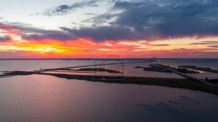 Photo for Aerial view of the Mobile Bay causeway and the Jubilee Parkway bridge at sunset on the Alabama Gulf Coast - Royalty Free Image