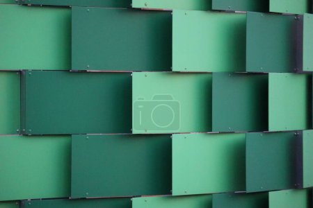 dark and light green Noise protection tiles are installed curved