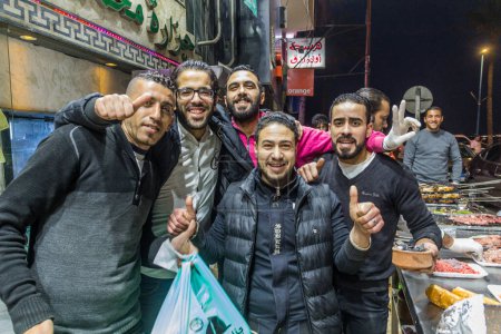Téléchargez les photos : ALEXANDRIA, EGYPT - FEBRUARY 1, 2019: Local people on a street in Alexandria, Egypt - en image libre de droit
