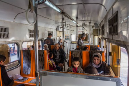 Téléchargez les photos : ALEXANDRIA, EGYPT - FEBRUARY 2, 2019: People riding a tram in Alexandria, Egypt - en image libre de droit