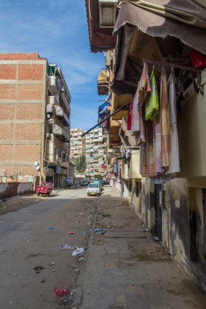 Foto de PORT FUAD, EGYPT - FEBRUARY 3, 2019: Stret with laundry in Port Fuad, Egypt - Imagen libre de derechos