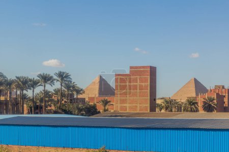Photo for Pyramids behind buildings of Giza, Egypt - Royalty Free Image