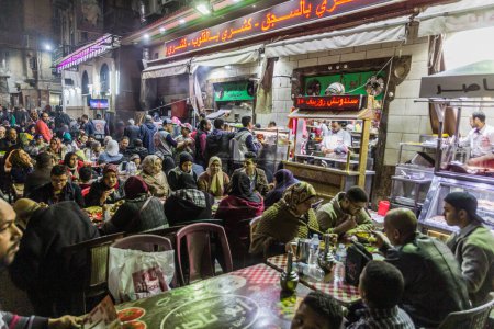 Foto de ALEXANDRIA, EGYPT - FEBRUARY 1, 2019: Evening view of street restaurants in Alexandria, Egypt - Imagen libre de derechos