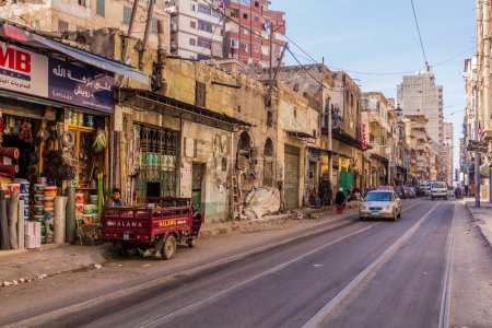 Foto de ALEXANDRIA, EGYPT - FEBRUARY 2, 2019: Street with tram tracks in Alexandria, Egypt - Imagen libre de derechos