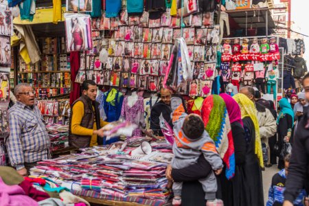 Téléchargez les photos : CAIRO, EGYPT - JANUARY 26, 2019: Lingerie shopping at a busy market street in Cairo, Egypt - en image libre de droit