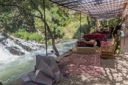 Photo for PALANGAN, IRAN - JULY 12, 2019: Riverside cafe near Palangan village in Kurdistan region, Iran - Royalty Free Image