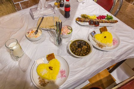 Photo for Meals in Iran. Ghormeh Sabzi and Kabab Koobideh, both with saffron rice. - Royalty Free Image