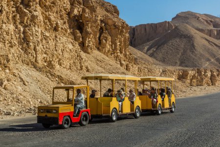 Photo for LUXOR, EGYPT - FEB 20, 2019: Toy train at the Valley of the Kings at the Theban Necropolis, Egypt - Royalty Free Image