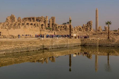 Photo for LUXOR, EGYPT - FEB 21, 2019: Sacred lake in the Karnak Temple Complex, Egypt - Royalty Free Image