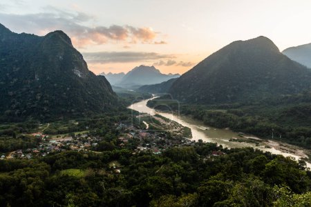 Photo for Evening aerial view of Muang Ngoi Neua village and Nam Ou river from Phanoi viewpoint, Laos - Royalty Free Image