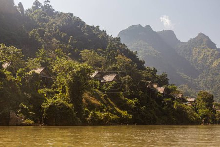 Photo for Houses in Nong Khiaw viewed from Nam Ou river, Laos - Royalty Free Image