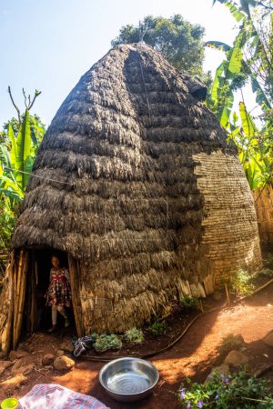 Photo for DORZE, ETHIOPIA - JANUARY 30, 2020: Traditional Dorze hut woven out of bamboo, Ethiopia - Royalty Free Image