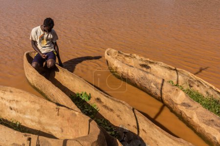 Photo for OMORATE, ETHIOPIA - FEBRUARY 5, 2020: Dugout canoes at the river Omo near Omorate village, Ethiopia - Royalty Free Image