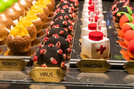 Photo for PRAGUE, CZECHIA - DECEMBER 10, 2021: Virus and vaccine pastry in Cerna madona cafe in Prague, Czech Republic - Royalty Free Image