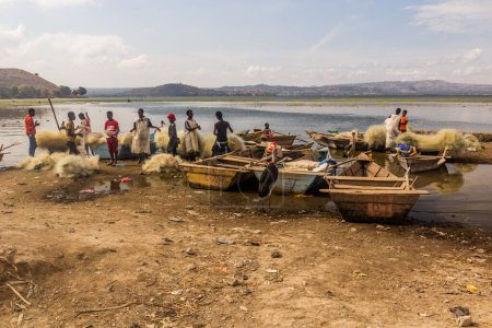 Photo for HAWASSA, ETHIOPIA - JANUARY 28, 2020: Fishing boats and nets at the fish market in Hawassa, Ethiopia - Royalty Free Image