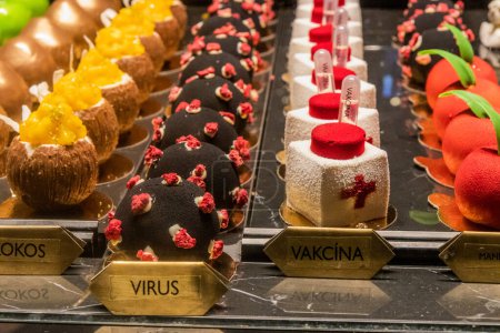 Photo for PRAGUE, CZECHIA - DECEMBER 10, 2021: Virus and vaccine pastry in Cerna madona cafe in Prague, Czech Republic - Royalty Free Image