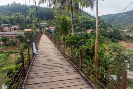 Photo for Suspension foot bridge in Muang Khua town, Laos - Royalty Free Image