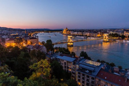 Photo for Evening view of Danube river with Szechenyi Lanchid bridge in Budapest, Hungary - Royalty Free Image