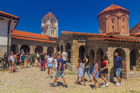 Photo for SVETI NAUM, NORTH MACEDONIA - AUGUST 8, 2019: People visit Sveti Naum monastery on Lake Ohrid, North Macedonia - Royalty Free Image