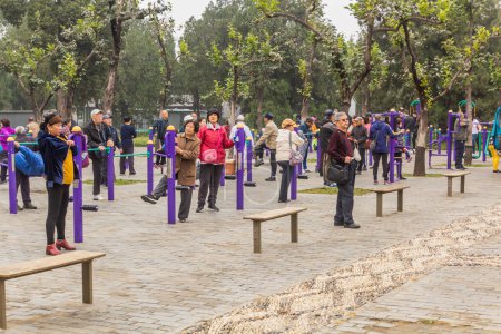 Photo for BEIJING, CHINA - OCTOBER 19, 2019: Elderly people excercise in the Temple of Heaven Park in Beijing, China - Royalty Free Image