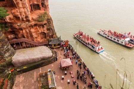 Photo for LE SHAN, CHINA  - NOVEMBER 6, 2019: Crowds of tourists at the feet of the Giant Buddha in Leshan, Sichuan province, China - Royalty Free Image