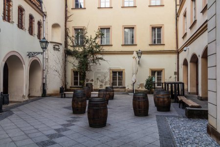 Photo for Wooden barrels serving as tables in the center of Brno, Czech Republic - Royalty Free Image