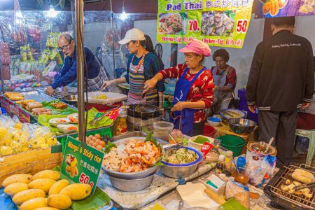 Photo for CHIANG MAI, THAILAND - DECEMBER 8, 2019: Food stall at the Sunday Night Market in Chiang Mai, Thailand - Royalty Free Image