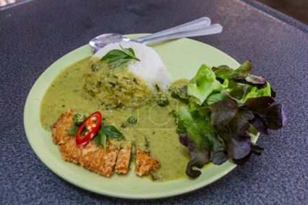 Photo for Meal in Thailand - Green curry with breaded chicken - Royalty Free Image