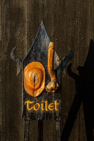 Photo for CHIANG RAI, THAILAND - NOVEMBER 30, 2019:  Toilet sign in the Baan Dam Museum (Black House) in Chiang Rai province, Thailand - Royalty Free Image