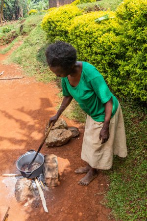 Photo for SIPI, UGANDA - FEBRUARY 27, 2020: Coffee roasting at a farm in Sipi village, Uganda - Royalty Free Image