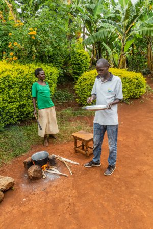 Photo for SIPI, UGANDA - FEBRUARY 27, 2020: Coffee roasting at a farm in Sipi village, Uganda - Royalty Free Image
