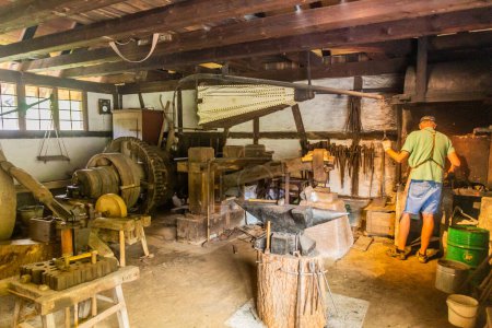 Photo for GUTACH, GERMANY - SEPTEMBER 2, 2019: Blacksmith workshop in Black Forest Open Air Museum in Gutach village in Baden-Wuerttemberg, Germany - Royalty Free Image